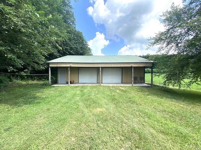 garage featuring a yard