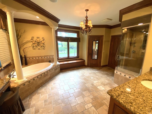 bathroom with vanity, plus walk in shower, a chandelier, ornate columns, and ornamental molding