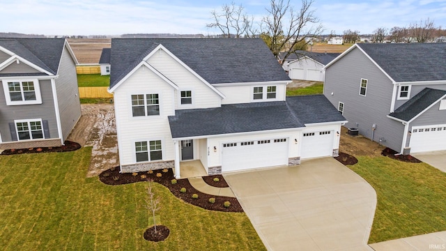 view of front facade with a front lawn and a garage