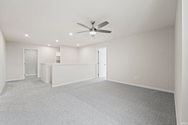 unfurnished room with light carpet and ceiling fan