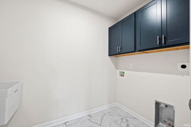 clothes washing area featuring electric dryer hookup, cabinets, light tile floors, and hookup for a washing machine