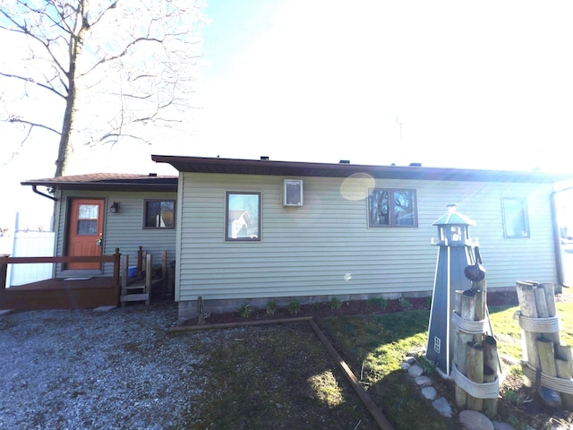 rear view of property with a deck