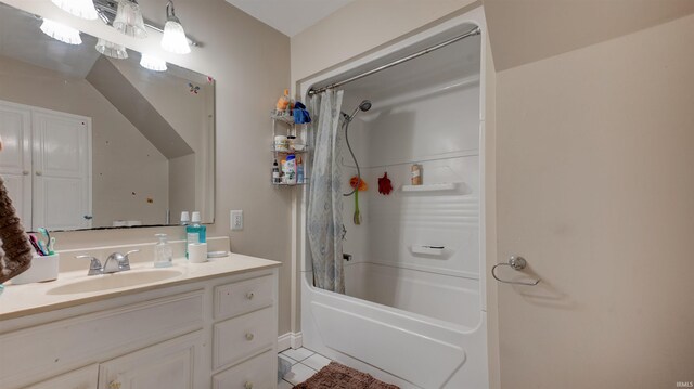 bathroom featuring shower / bath combo with shower curtain, tile floors, and vanity