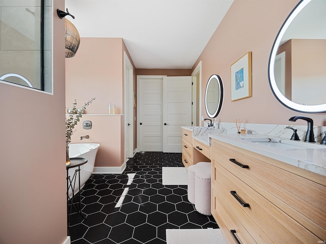 bathroom with vanity and tile flooring