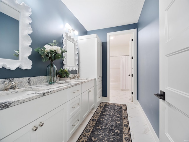 bathroom with double vanity and tile floors