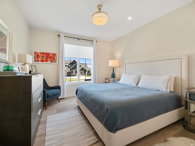 bedroom with light hardwood / wood-style flooring