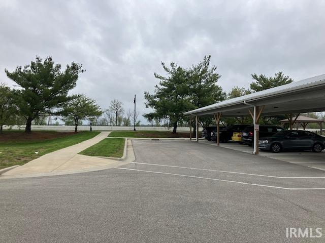 view of parking featuring a carport