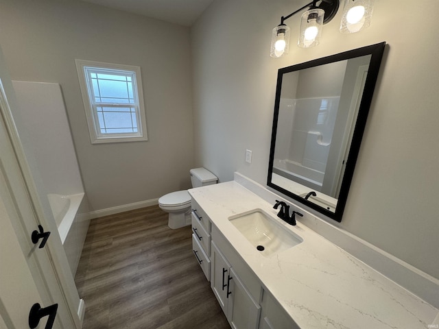 full bathroom with vanity, toilet, wood-type flooring, and shower / washtub combination