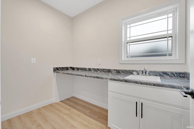 bathroom featuring vanity and hardwood / wood-style flooring