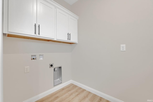 laundry room with hookup for an electric dryer, hookup for a washing machine, cabinets, and light hardwood / wood-style floors