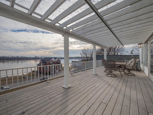 wooden terrace featuring a pergola and a water view