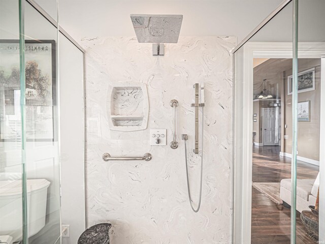 bathroom featuring toilet and hardwood / wood-style flooring