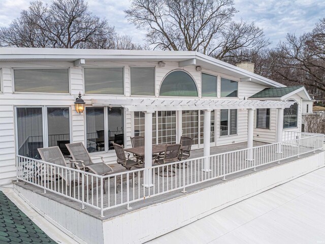 rear view of house with a pergola