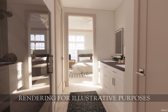 bathroom featuring ceiling fan, tile patterned flooring, and sink