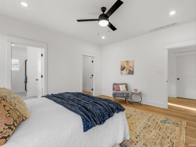 bedroom featuring ceiling fan and hardwood / wood-style floors