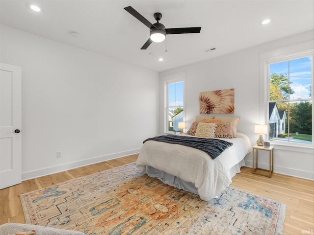 bedroom featuring light wood-type flooring and ceiling fan