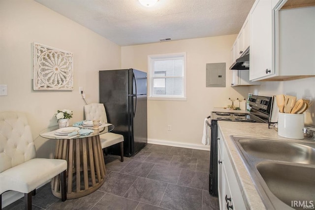 kitchen featuring black refrigerator, white cabinets, electric range, sink, and dark tile flooring