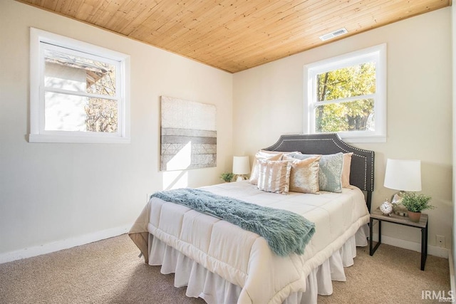 bedroom with light carpet and wooden ceiling