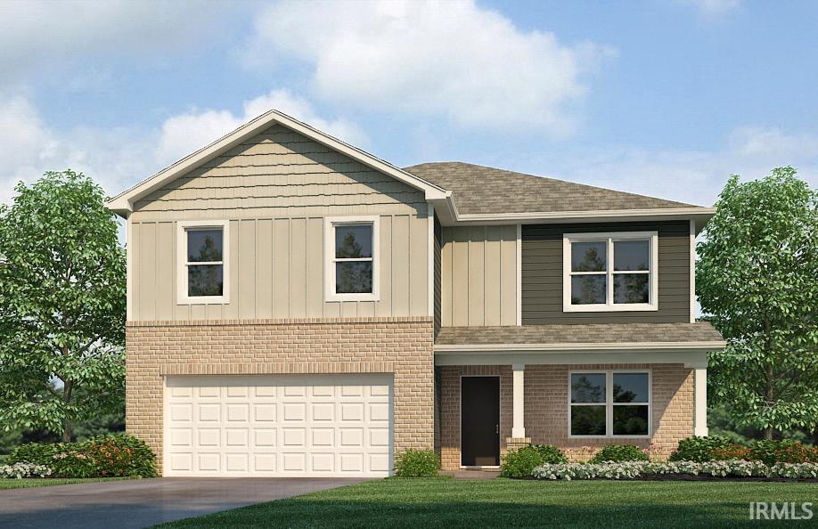 view of front facade with a garage and a front yard