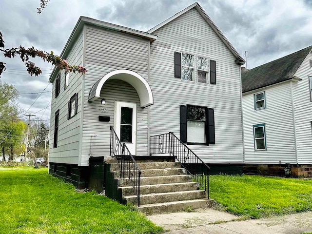 view of front of home featuring a front lawn