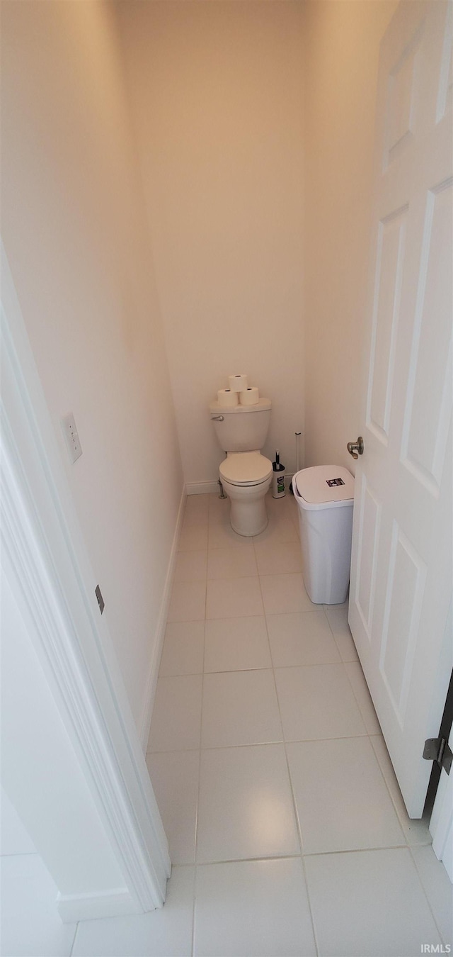 bathroom featuring toilet and tile patterned floors