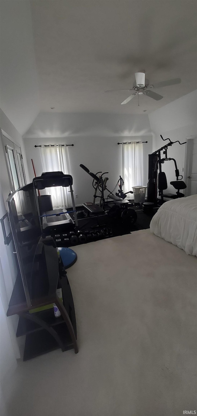 bedroom featuring ceiling fan and lofted ceiling