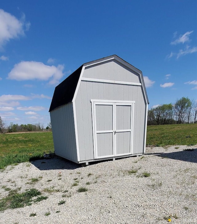 view of outbuilding featuring a yard