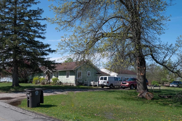 view of side of home featuring a lawn