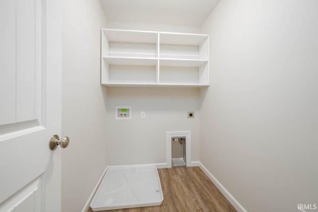 laundry room with hardwood / wood-style flooring, washer hookup, and electric dryer hookup