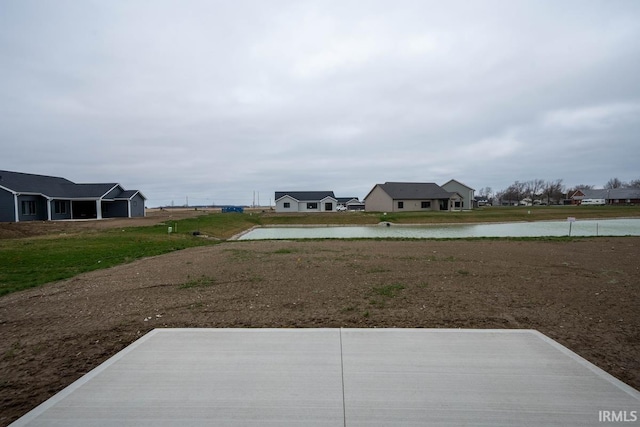 view of yard with a water view