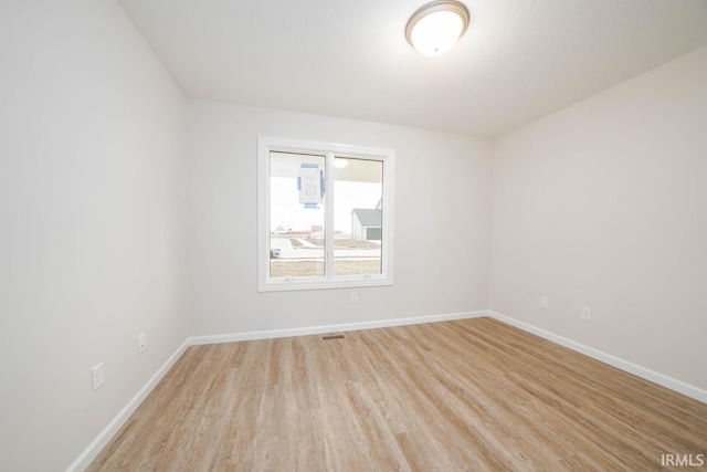 empty room featuring light hardwood / wood-style floors