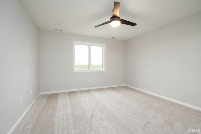 unfurnished room featuring carpet floors and ceiling fan