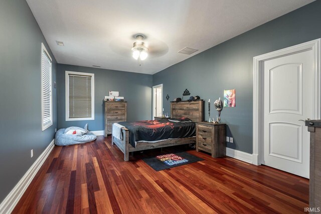 bedroom with hardwood / wood-style floors and ceiling fan