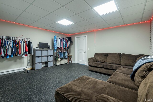 carpeted living room with a paneled ceiling