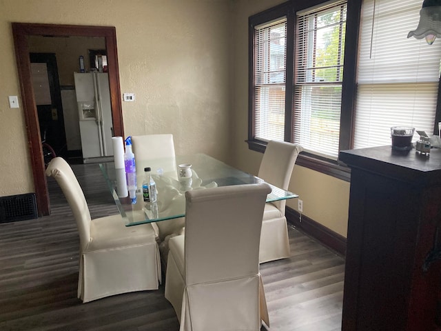 dining area with hardwood / wood-style flooring