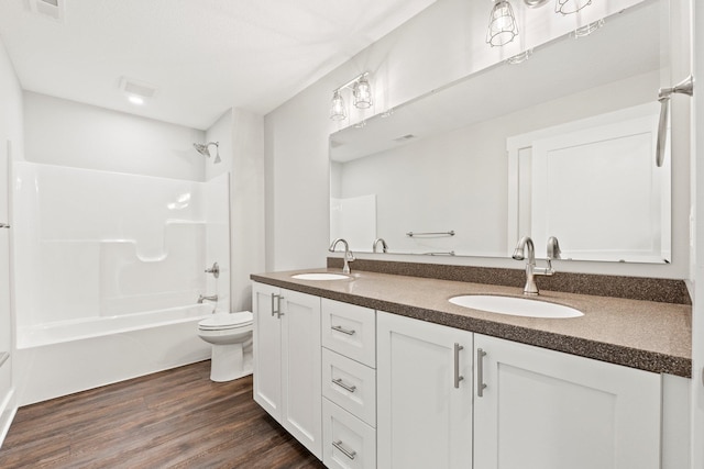 51 Ln 345 Crooked Lk, Angola, IN 46703 - full bathroom with  shower combination, double sink, oversized vanity, hardwood / wood-style flooring, and toilet