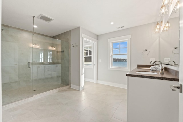 51 Ln 345 Crooked Lk, Angola, IN 46703 - bathroom featuring tile flooring, an enclosed shower, and double sink vanity