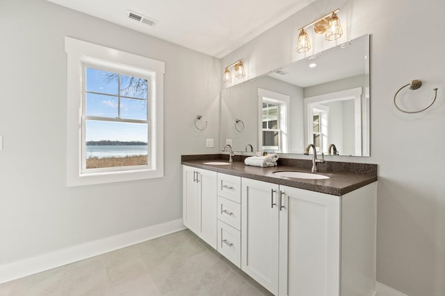 15 Ln 345 Crooked Lk, Angola, IN 46703 - bathroom with a water view, tile floors, and dual vanity