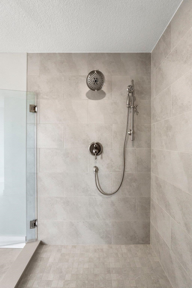15 Ln 345 Crooked Lk, Angola, IN 46703 - bathroom featuring tiled shower and a textured ceiling