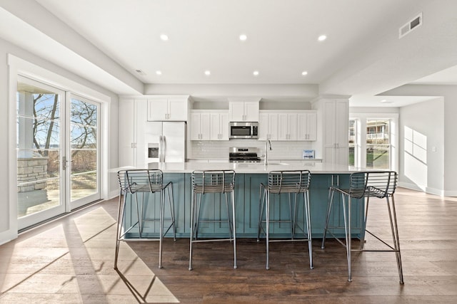 15 Ln 345 Crooked Lk, Angola, IN 46703 - kitchen featuring plenty of natural light, hardwood / wood-style flooring, stainless steel appliances, and a spacious island