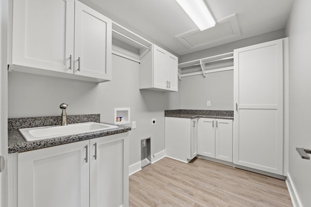 19 Ln 345 Crooked Lk, Angola, IN 46703 - clothes washing area with washer hookup, light hardwood / wood-style floors, cabinets, and sink