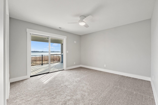 19 Ln 345 Crooked Lk, Angola, IN 46703 - empty room featuring ceiling fan, carpet floors, and a water view