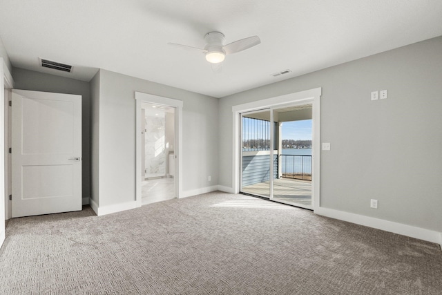19 Ln 345 Crooked Lk, Angola, IN 46703 - unfurnished bedroom featuring ensuite bath, access to exterior, ceiling fan, and carpet floors