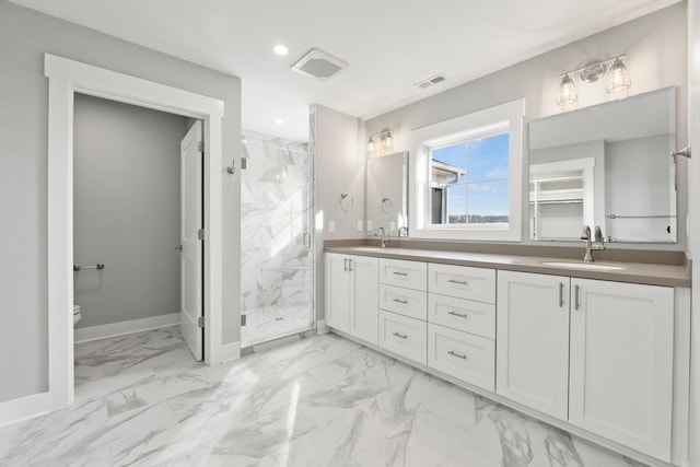 19 Ln 345 Crooked Lk, Angola, IN 46703 - bathroom with dual sinks, tiled shower, tile floors, and vanity with extensive cabinet space