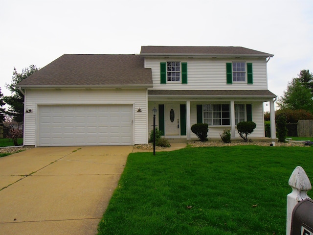 front facade featuring a garage and a front lawn