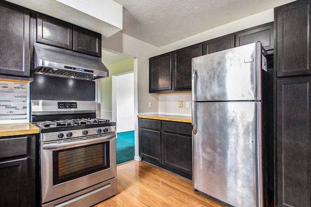 kitchen with light hardwood / wood-style floors and stainless steel appliances