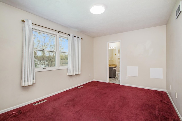 spare room featuring carpet floors