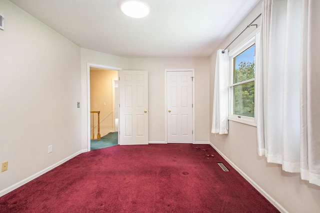 unfurnished bedroom featuring carpet floors