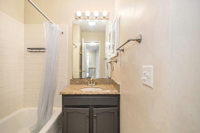 bathroom featuring shower / tub combo and vanity