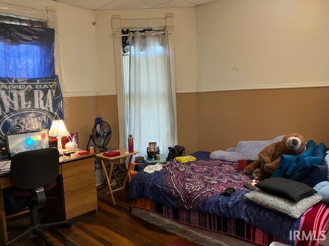 bedroom featuring dark hardwood / wood-style floors